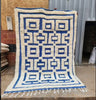 Handwoven Moroccan wool rug blue geometric — workshop view