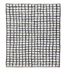 A rectangular area rug with a black hand-drawn grid pattern on an off-white background, shown flat against a solid white backdrop.