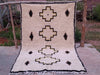 Flat lay of the complete Azel Azilal rug on Moroccan earth, Azilal region