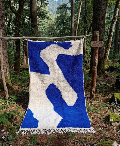 Asif — The River, handwoven Moroccan wool rug, ivory current on cobalt blue field, Atlas Forest, Morocco