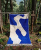 Asif — The River, handwoven Moroccan wool rug, ivory current on cobalt blue field, Atlas Forest, Morocco