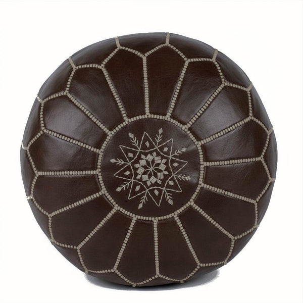 Brown leather pouf with geometric pattern on a white background