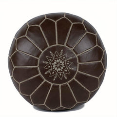 Brown leather pouf with geometric pattern on a white background