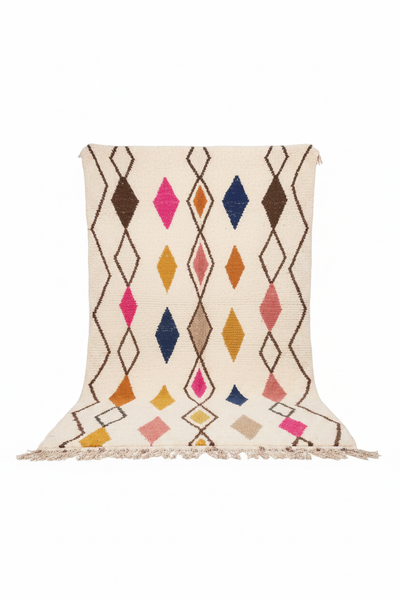 Moroccan Azilal rug, ivory ground with multicolor diamond pattern, studio white background