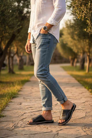 Male model wearing black leather sandals