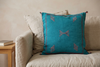 Mizan turquoise pillow, Behind the Object hero