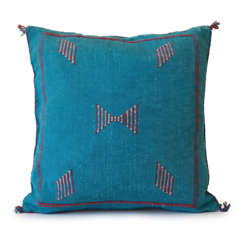 Mizan turquoise pillow on a white background