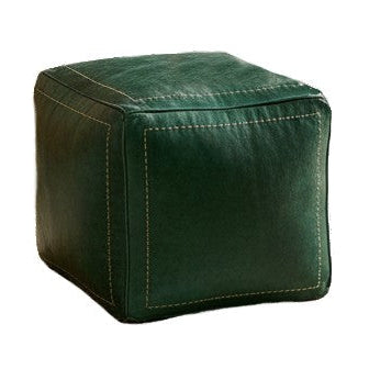 Green cube-shaped ottoman on a white background