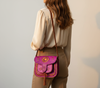 Professional model showcasing LSSAN Fuchsia Embroidered Moroccan leather bag