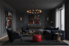 Modern dark-themed living room with a chandelier, sofa, and abstract art.