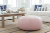 Soft pink leather ottoman in coastal living room - wider