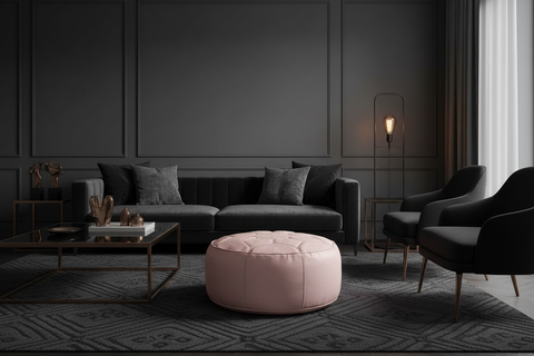 Soft pink leather ottoman in luxurious dark living room - round