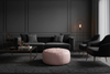 Soft pink leather ottoman in luxurious dark living room - round