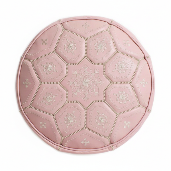 Soft pink leather ottoman - top view on white background