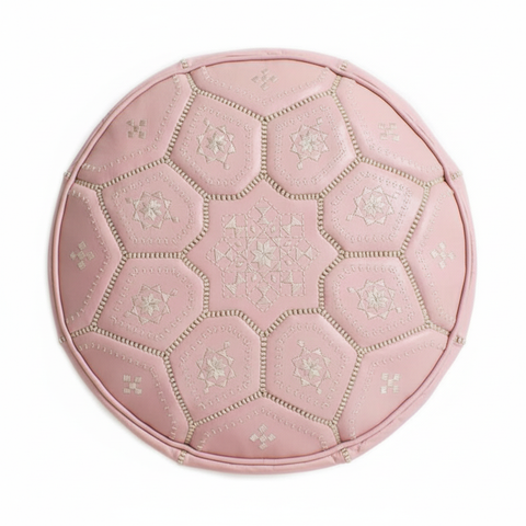 Soft pink leather ottoman - top view on white background